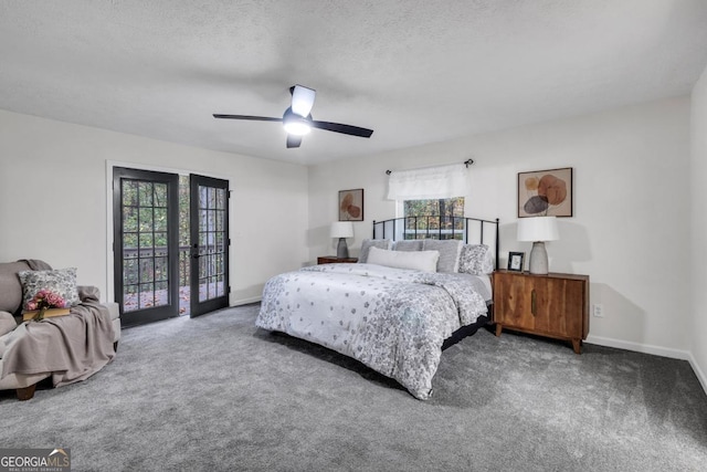 carpeted bedroom featuring multiple windows, french doors, a textured ceiling, and ceiling fan