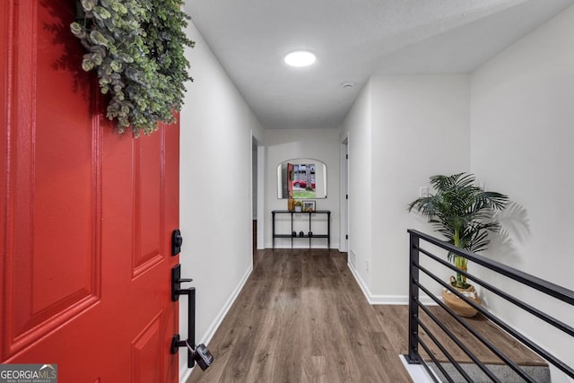 hallway featuring wood-type flooring