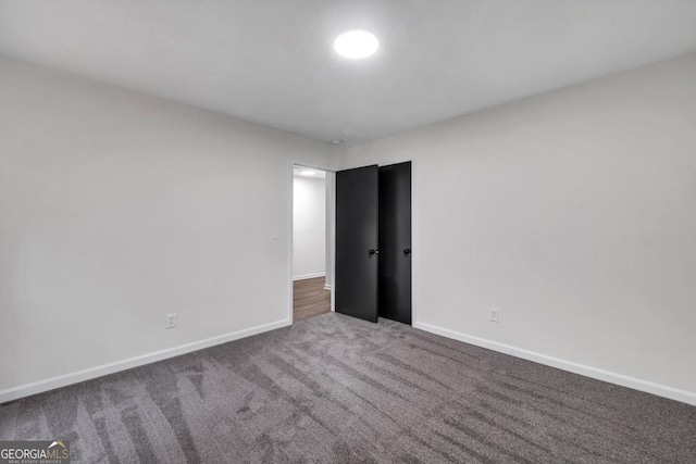 unfurnished room featuring carpet floors