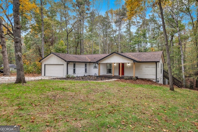 ranch-style home with a porch, a garage, and a front lawn