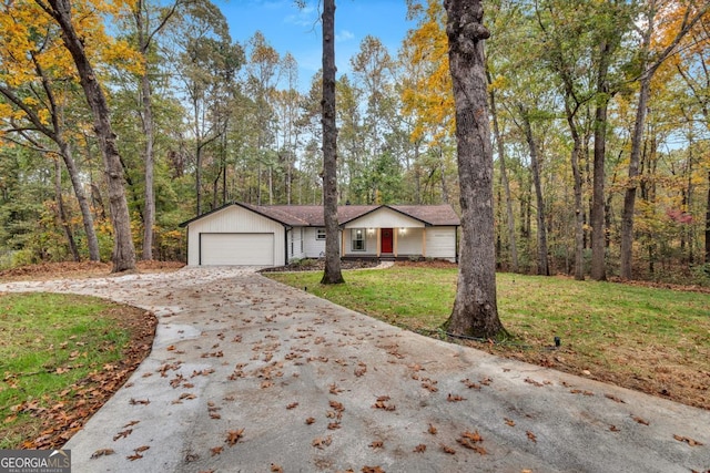 view of front of home with a garage and a front yard