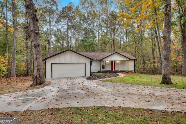 view of front of house featuring a porch and a garage