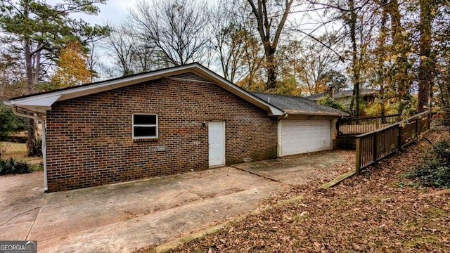 view of side of property with a garage