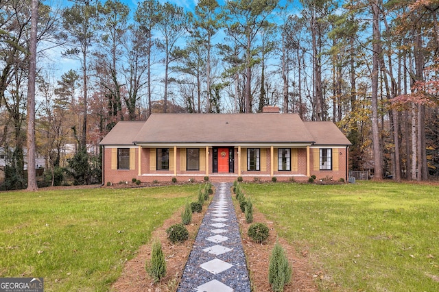 ranch-style home featuring a front yard