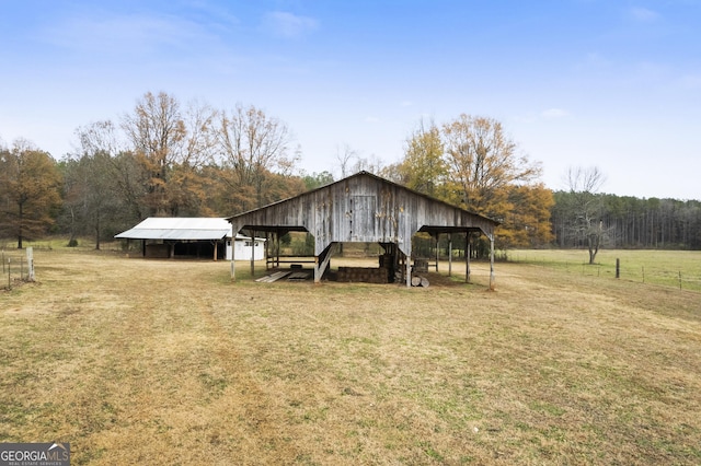 view of outbuilding with a rural view