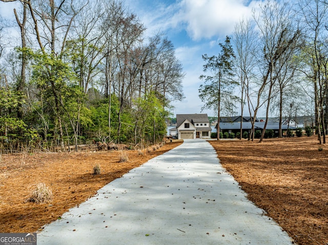 surrounding community with concrete driveway