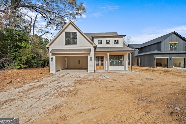 modern farmhouse style home with french doors