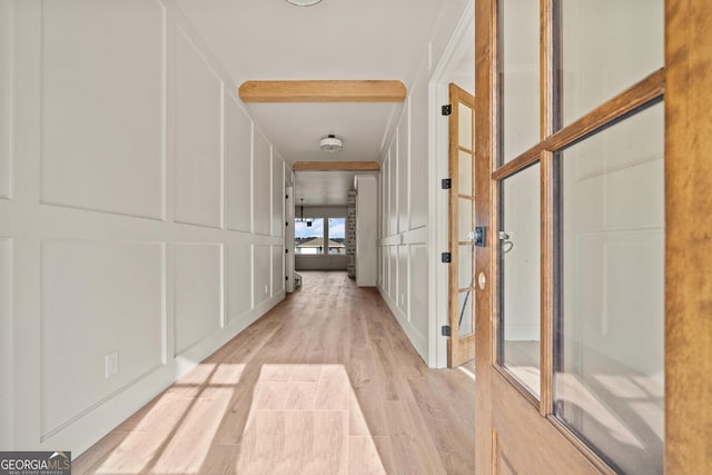 hall with light hardwood / wood-style floors