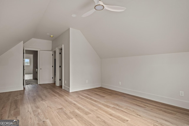 bonus room featuring ceiling fan, light hardwood / wood-style floors, and lofted ceiling