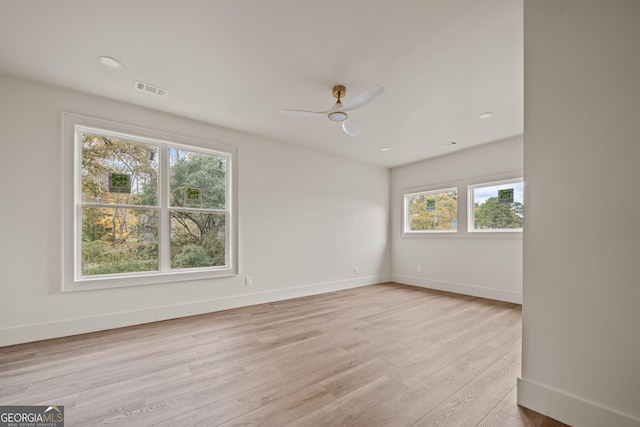 spare room with ceiling fan and light hardwood / wood-style floors