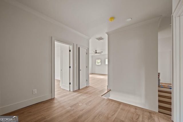 empty room with ceiling fan and light wood-type flooring