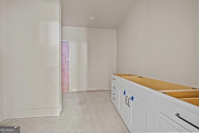 bathroom with concrete flooring