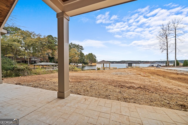 view of patio featuring a water view