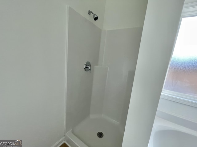 bathroom featuring walk in shower