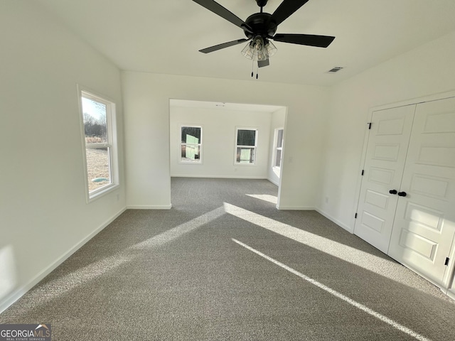 carpeted empty room with ceiling fan