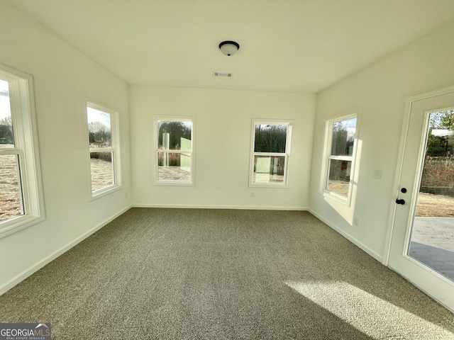 unfurnished sunroom featuring a wealth of natural light