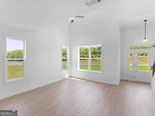 1215 White Oak Way, Griffin, GA 30224 - spare room with plenty of natural light, light wood finished floors, and a high ceiling