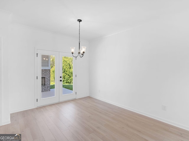 1215 White Oak Way, Griffin, GA 30224 - unfurnished room featuring light wood finished floors, a chandelier, french doors, baseboards, and ornamental molding