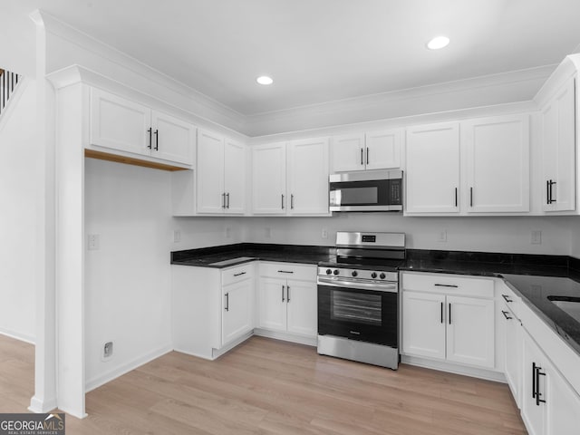 1215 White Oak Way, Griffin, GA 30224 - kitchen with appliances with stainless steel finishes, crown molding, white cabinets, light wood-style flooring, and recessed lighting