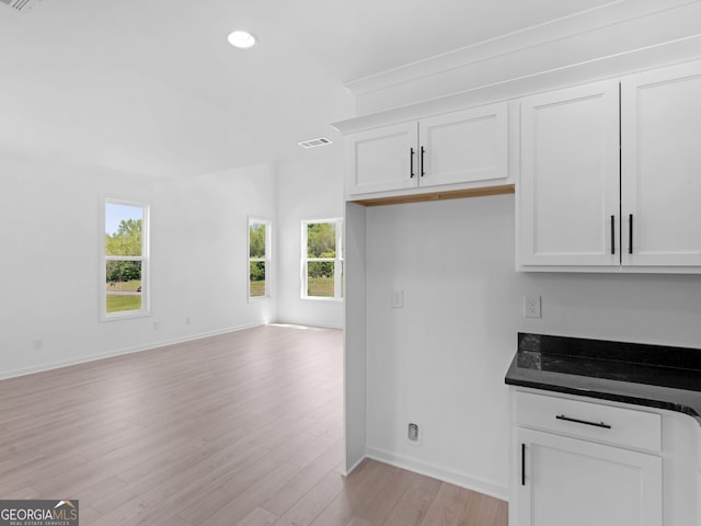 1215 White Oak Way, Griffin, GA 30224 - kitchen featuring open floor plan, light wood-style floors, baseboards, recessed lighting, and white cabinets