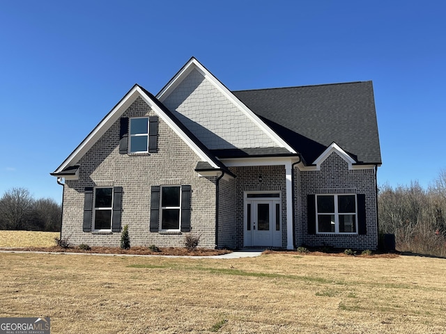 view of front of property with a front lawn