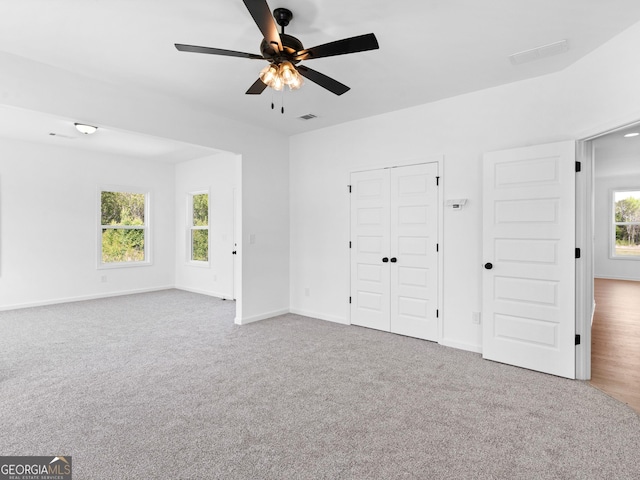 1215 White Oak Way, Griffin, GA 30224 - unfurnished bedroom with carpet flooring, a closet, and ceiling fan