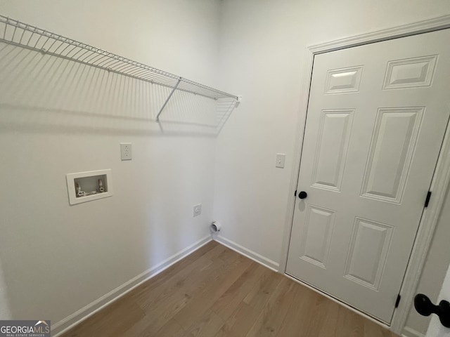 laundry area featuring hookup for an electric dryer, hookup for a washing machine, and hardwood / wood-style floors