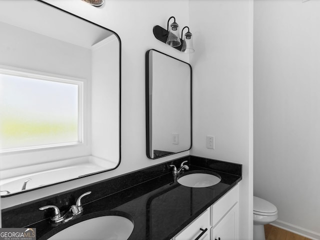 1215 White Oak Way, Griffin, GA 30224 - bathroom featuring double vanity and toilet