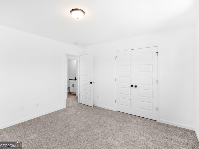 1215 White Oak Way, Griffin, GA 30224 - unfurnished bedroom featuring carpet, baseboards, and a closet