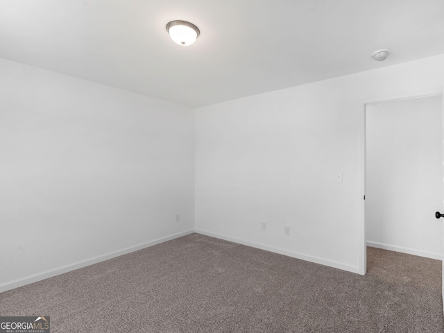 1215 White Oak Way, Griffin, GA 30224 - carpeted empty room featuring baseboards and a smoke detector