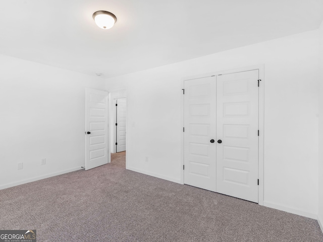 1215 White Oak Way, Griffin, GA 30224 - unfurnished bedroom featuring carpet flooring and a closet