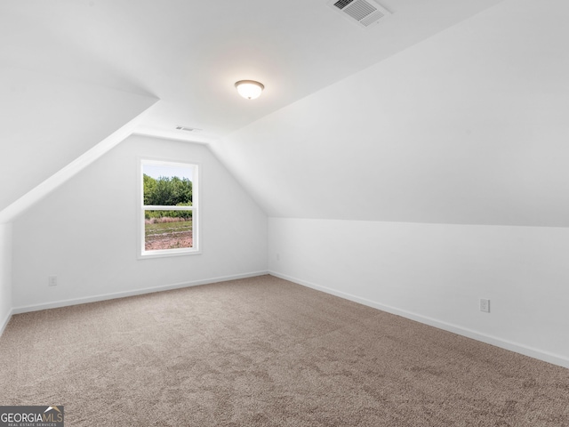 1215 White Oak Way, Griffin, GA 30224 - bonus room featuring carpet floors, vaulted ceiling, and baseboards