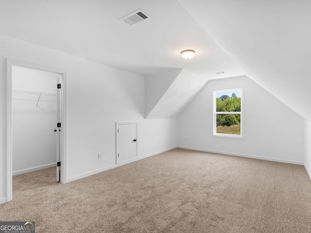 1215 White Oak Way, Griffin, GA 30224 - additional living space with carpet flooring, lofted ceiling, and baseboards