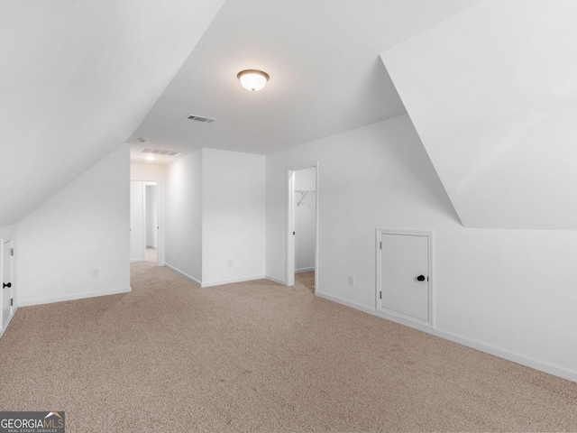1215 White Oak Way, Griffin, GA 30224 - bonus room with light colored carpet, lofted ceiling, and baseboards