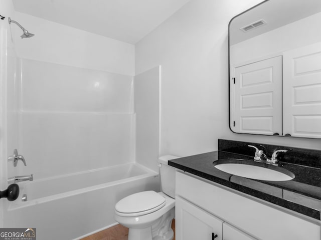 1215 White Oak Way, Griffin, GA 30224 - full bathroom with vanity, toilet, shower / bathtub combination, and wood finished floors