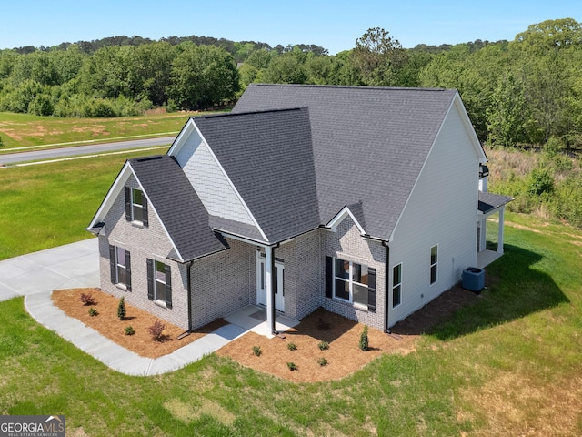 1215 White Oak Way, Griffin, GA 30224 - view of home's exterior featuring a lawn, roof with shingles, cooling unit, and brick siding
