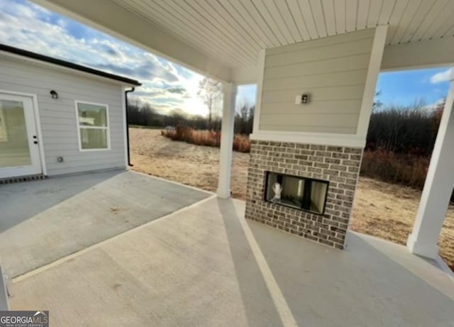 1215 White Oak Way, Griffin, GA 30224 - view of patio / terrace featuring an outdoor brick fireplace
