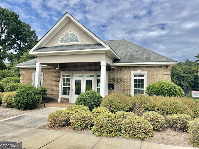 1215 White Oak Way, Griffin, GA 30224 - view of front of home with brick siding, french doors, and roof with shingles
