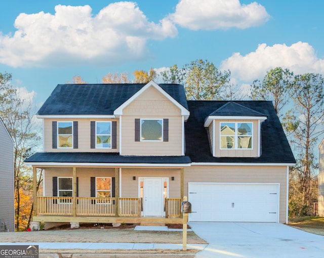 view of front of home with covered porch and a garage