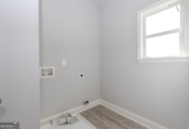 laundry area with baseboards, laundry area, washer hookup, and hookup for an electric dryer