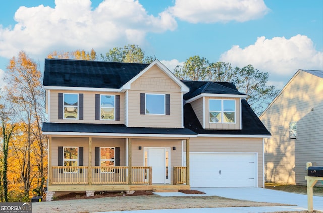 view of front facade featuring covered porch and a garage