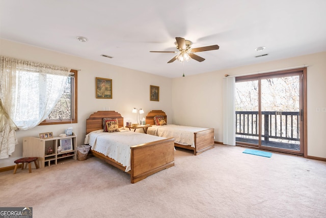 bedroom with access to exterior, light colored carpet, and ceiling fan