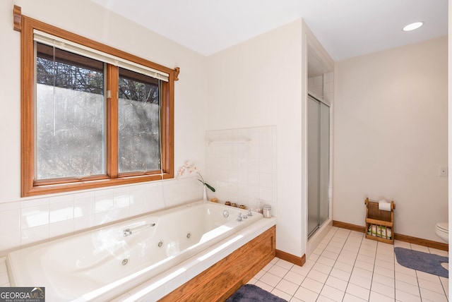 bathroom featuring toilet, tile patterned floors, and independent shower and bath