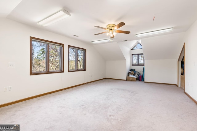 additional living space featuring carpet flooring, ceiling fan, and lofted ceiling