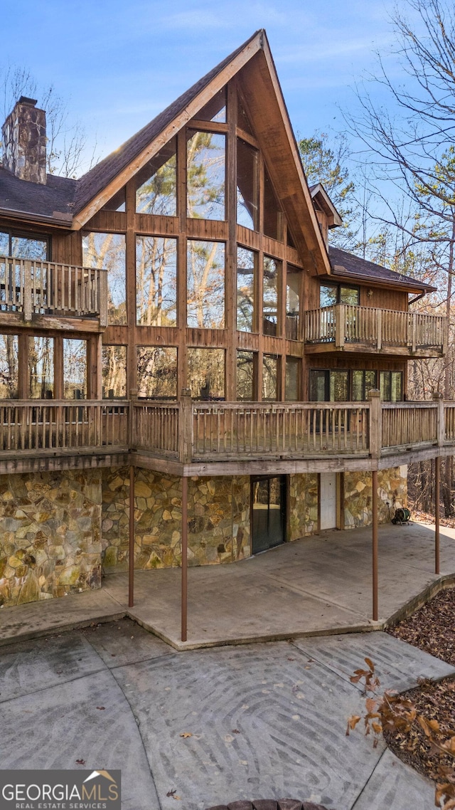 rear view of house with a balcony