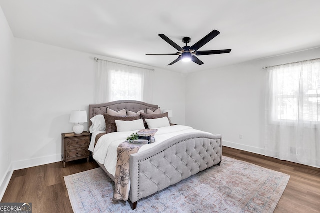 bedroom with hardwood / wood-style floors and ceiling fan