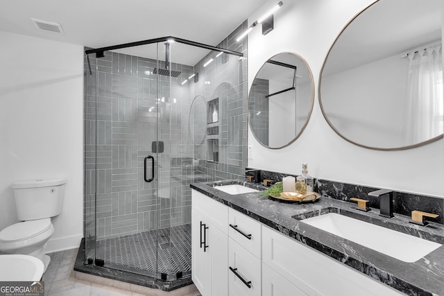 bathroom with vanity, a bidet, tile patterned flooring, toilet, and an enclosed shower