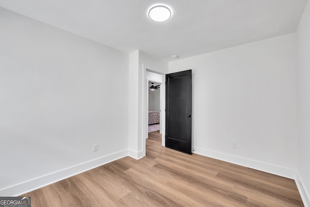 spare room with light hardwood / wood-style floors