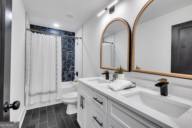 full bathroom with vanity, toilet, and shower / bath combo with shower curtain