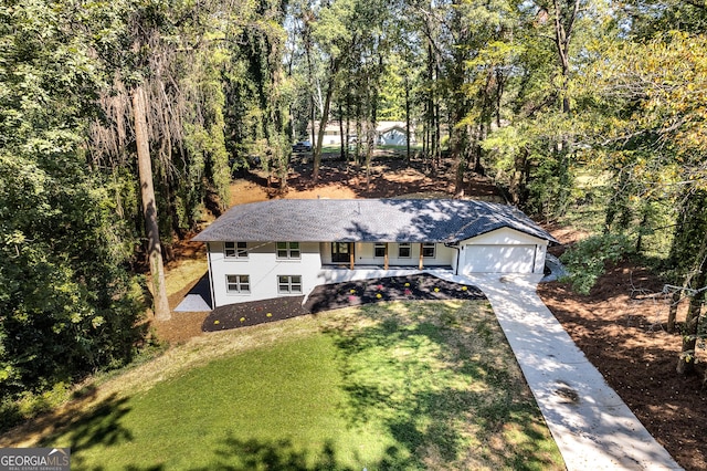 view of front of home with a garage and a front yard